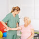 Older woman getting shoulder rehab therapy